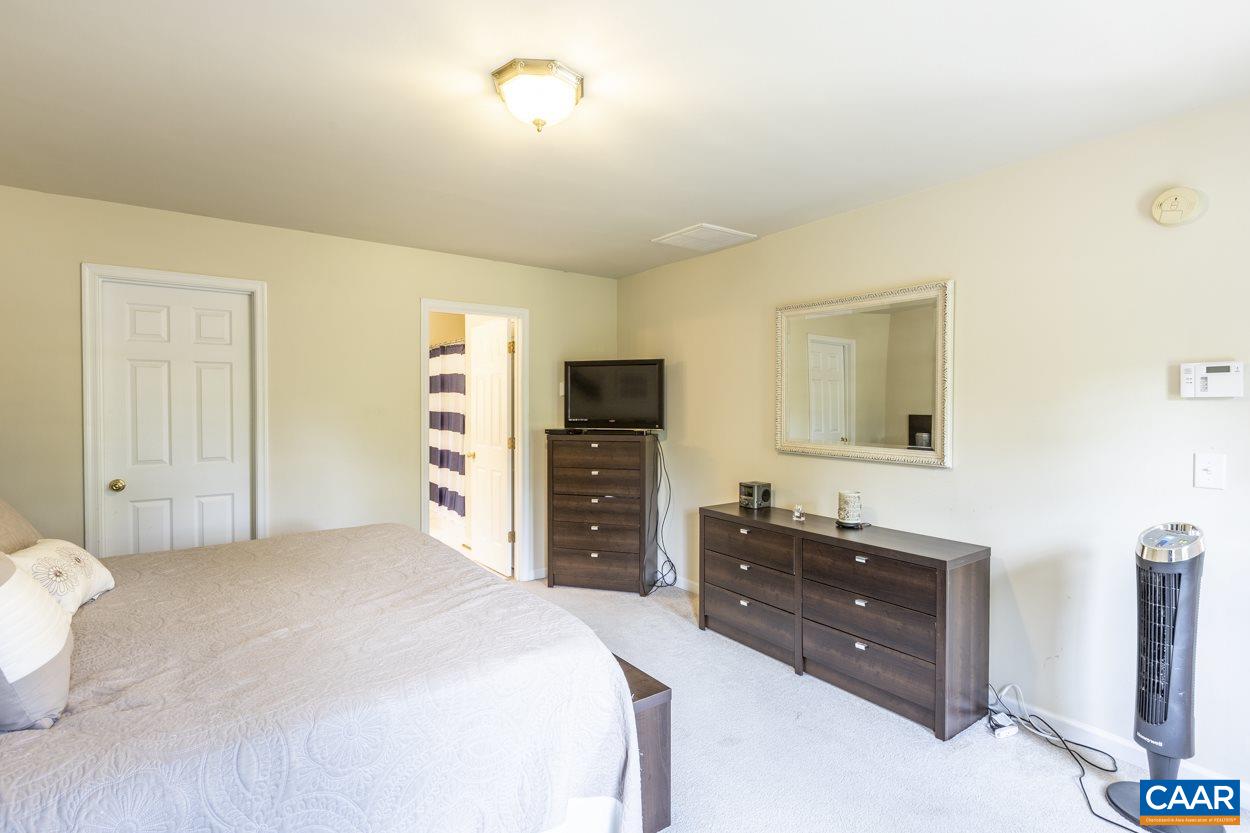 161 Jordan Store Road Kents Store, VA 23084 - Photo 26 of 50 a bedroom with a bed and a television