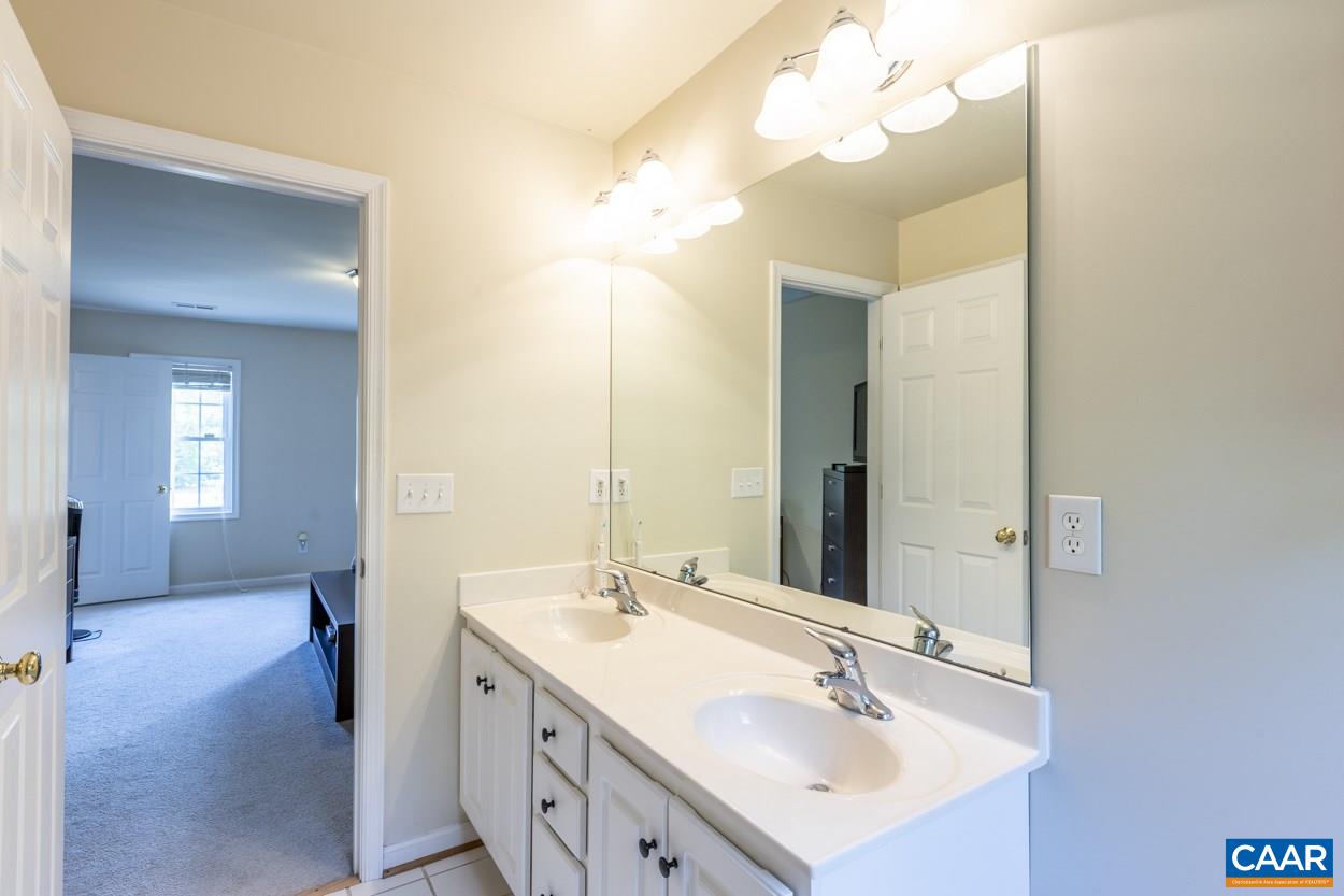 161 Jordan Store Road Kents Store, VA 23084 - Photo 28 of 50 a bathroom with a sink vanity and a mirror