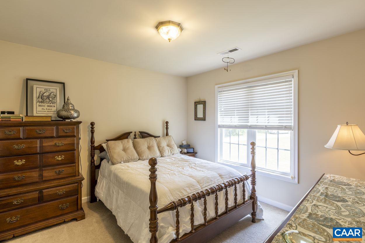 161 Jordan Store Road Kents Store, VA 23084 - Photo 29 of 50 a bedroom with a bed and a window