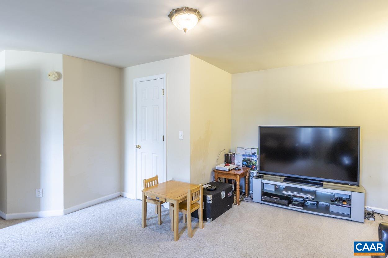 161 Jordan Store Road Kents Store, VA 23084 - Photo 35 of 50 a living room with furniture and a flat screen tv