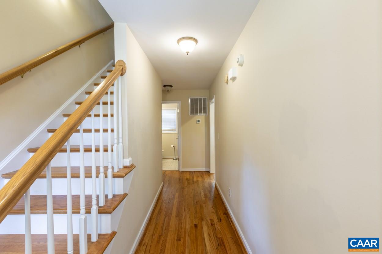 161 Jordan Store Road Kents Store, VA 23084 - Photo 8 of 50 a view of a hallway with wooden floor and staircase
