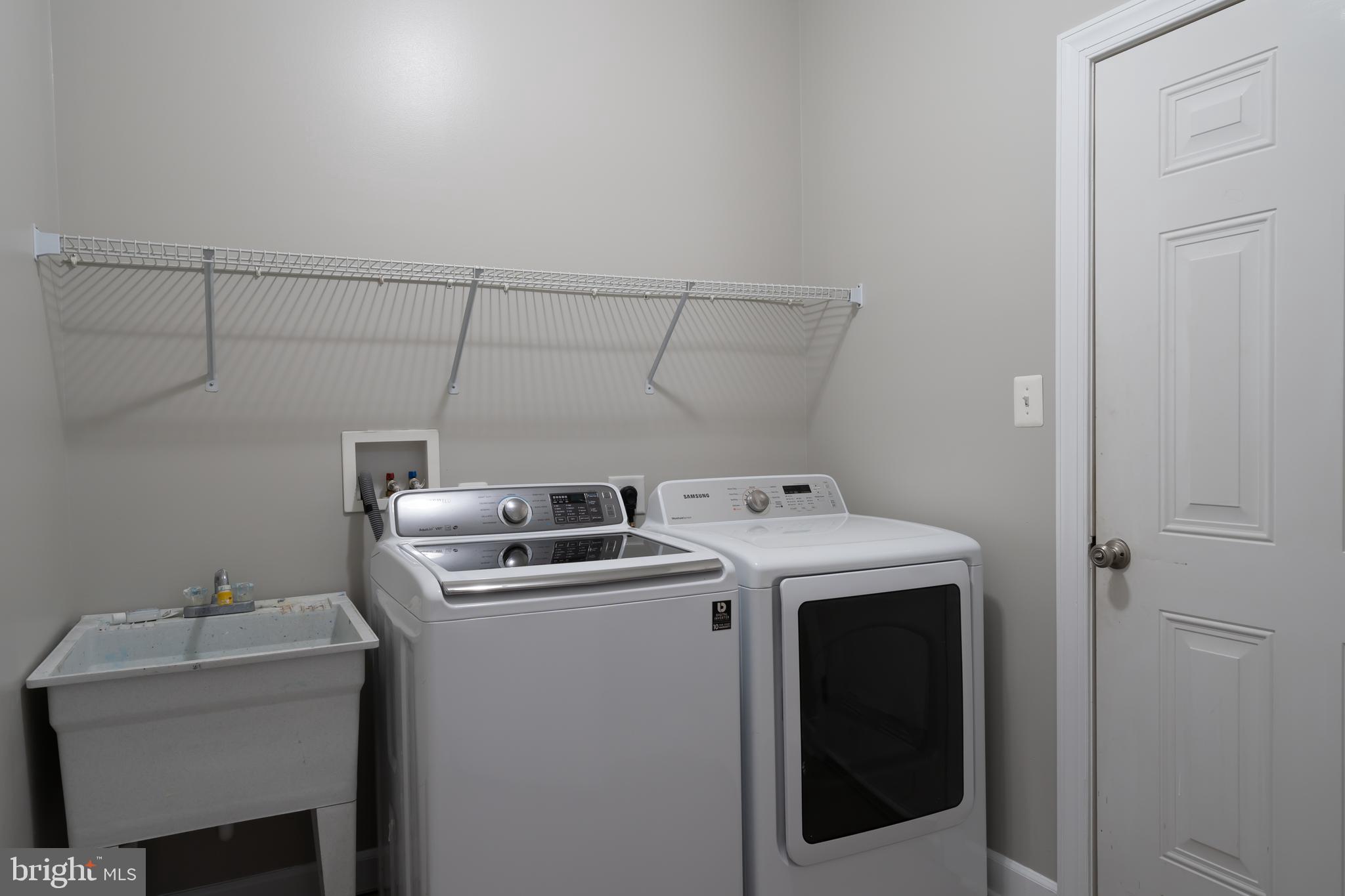 30965 Starling Road, Unit 106D Ocean View, DE 19970 - Photo 16 of 56 Laundry room with washer/dryer on main level