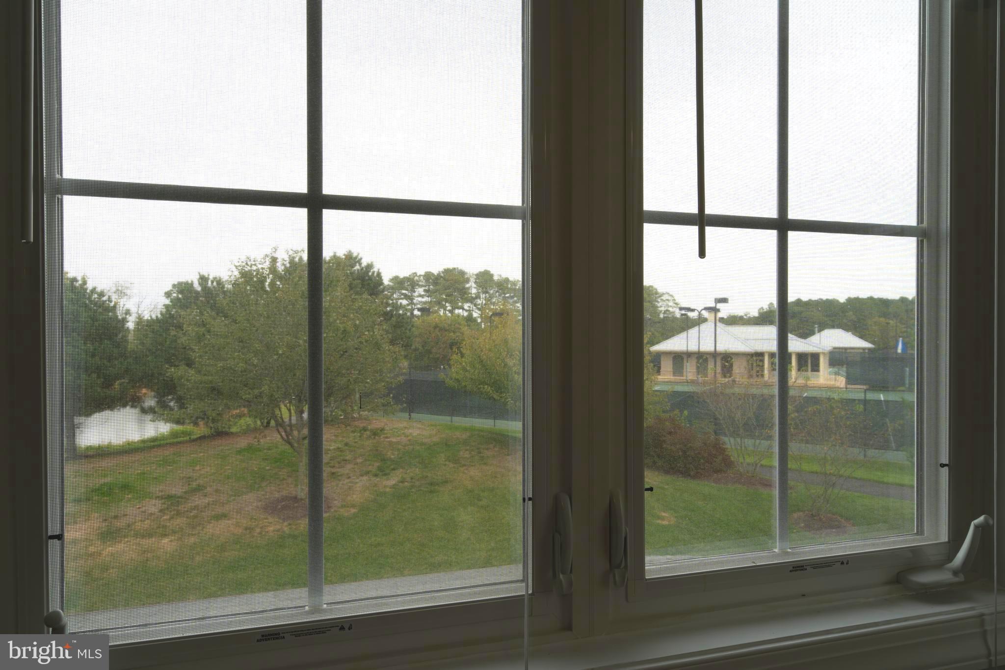 30965 Starling Road, Unit 106D Ocean View, DE 19970 - Photo 25 of 56 View of pond & trees from upstairs bedroom window