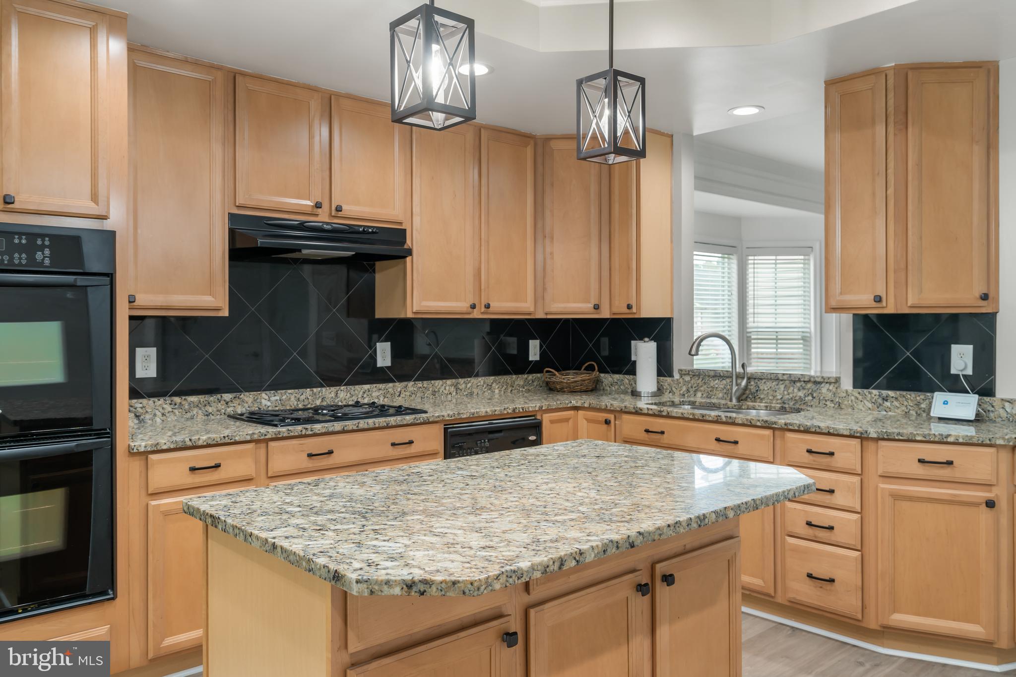 30965 Starling Road, Unit 106D Ocean View, DE 19970 - Photo 10 of 56 Kitchen has granite counters and island