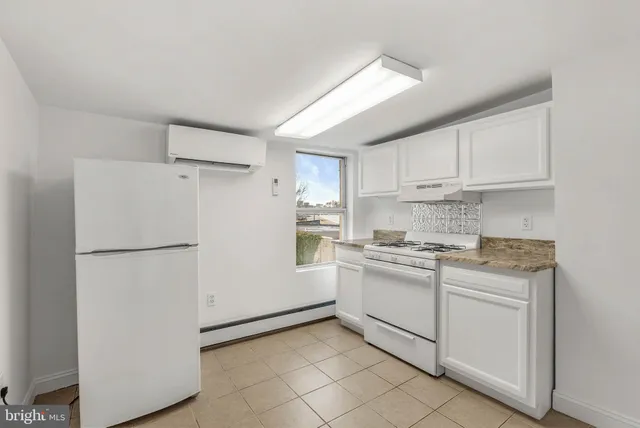 a kitchen with stainless steel appliances granite countertop white refrigerator stove a sink and dishwasher