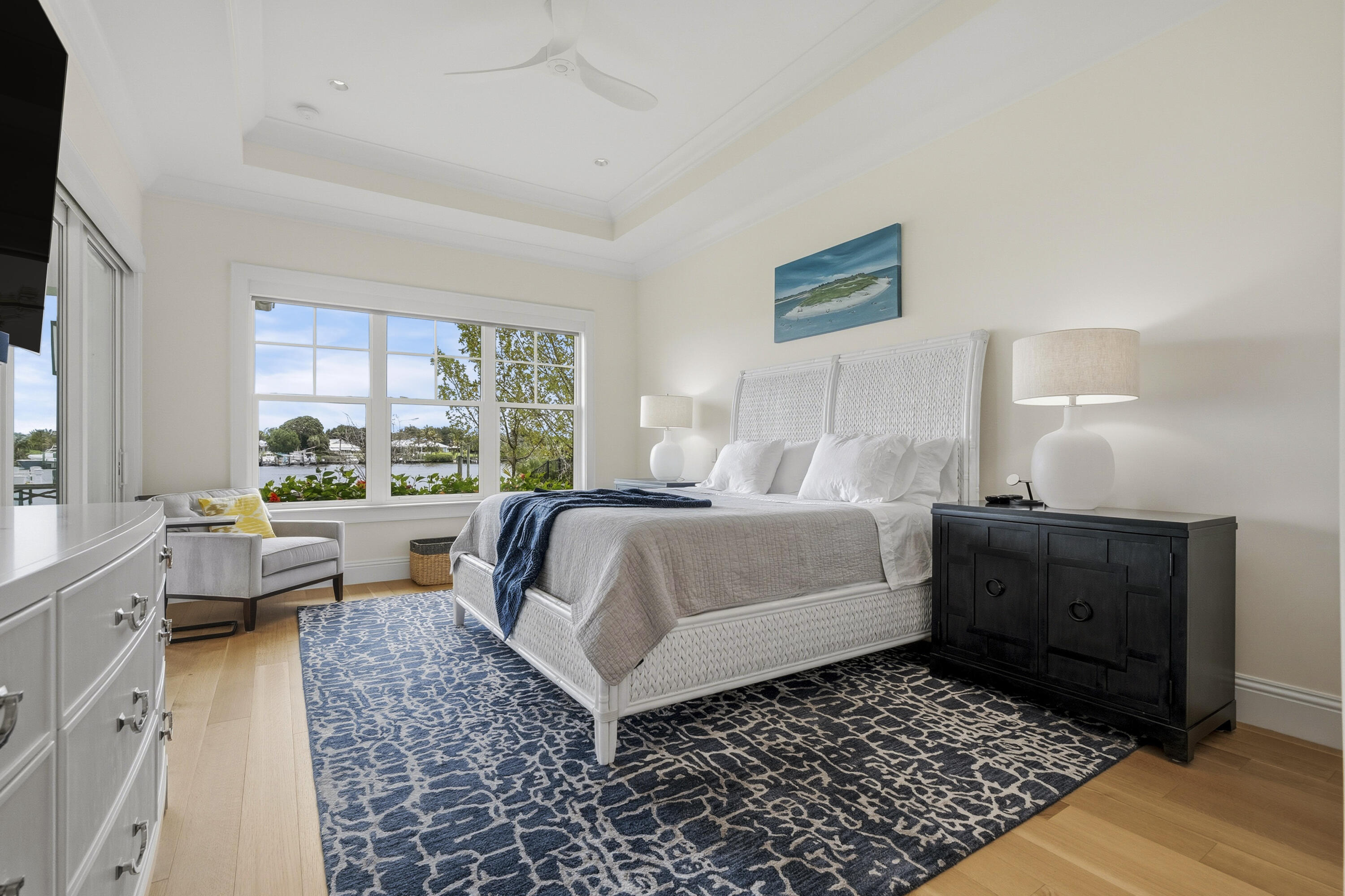3973 Southeast Topsail Court Stuart, FL 34997 - Photo 14 of 38 a bedroom with a bed and a couch