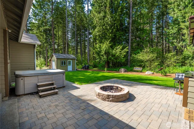 a view of a chair and table in front of house