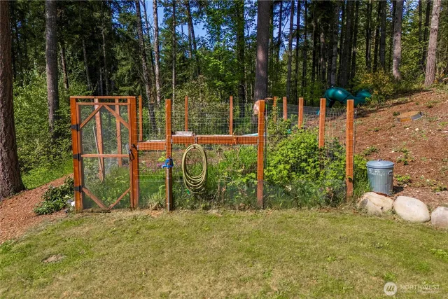 a swimming pool with outdoor seating and yard