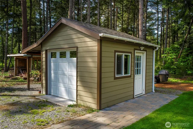 a view of a chairs in a backyard