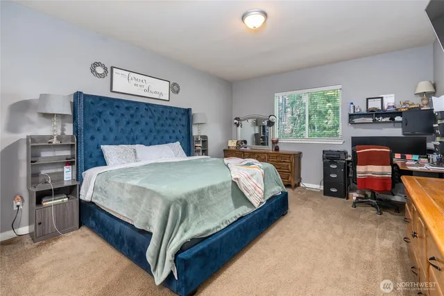 a spacious bathroom with a granite countertop sink and a mirror