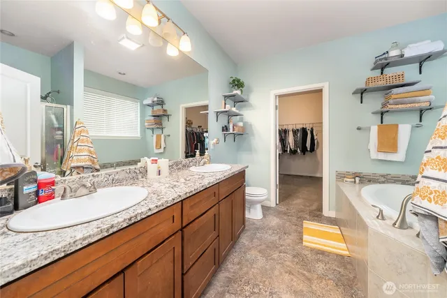 a bathroom with a tub and a window