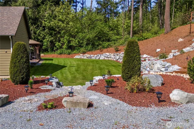 a view of a chairs and table in the garden