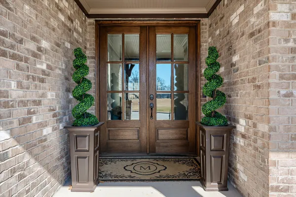 a kitchen with stainless steel appliances granite countertop a sink and dishwasher a stove top oven with wooden floor