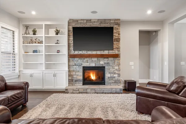 a view of a dining room with furniture wooden floor and chandelier