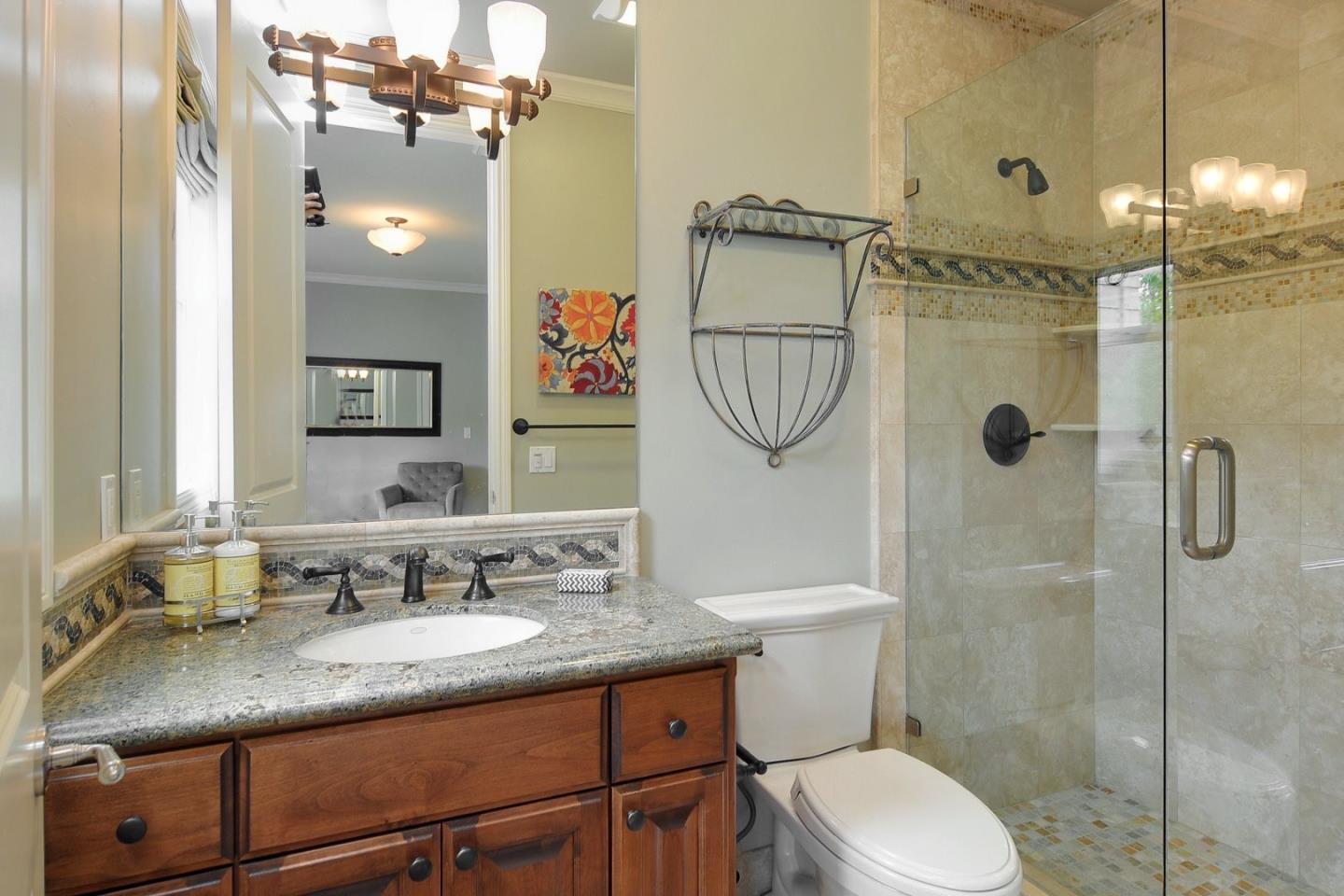 738 Springer Road Los Altos, CA 94024 - Photo 18 of 25 a bathroom with a granite countertop sink toilet and shower