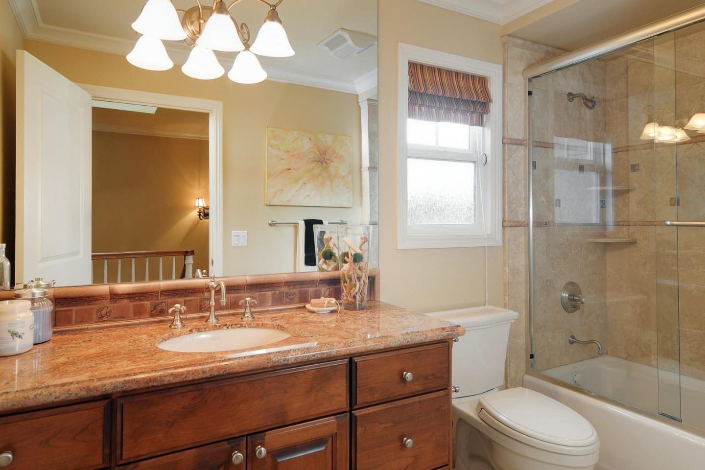 738 Springer Road Los Altos, CA 94024 - Photo 20 of 25 a bathroom with a sink a toilet a mirror and shower