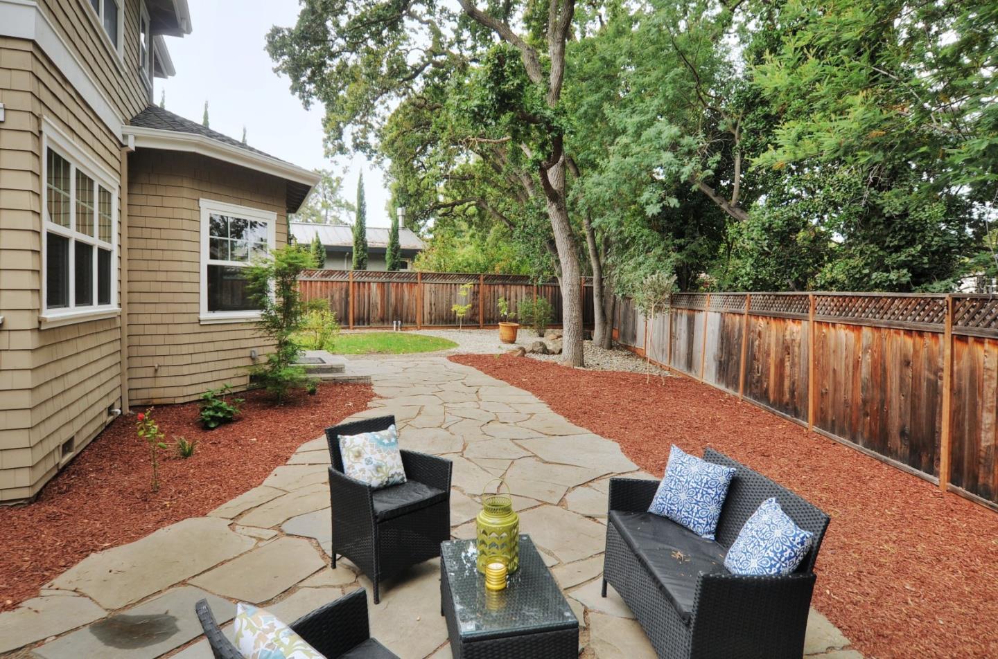 738 Springer Road Los Altos, CA 94024 - Photo 24 of 25 a backyard of a house with table and chairs