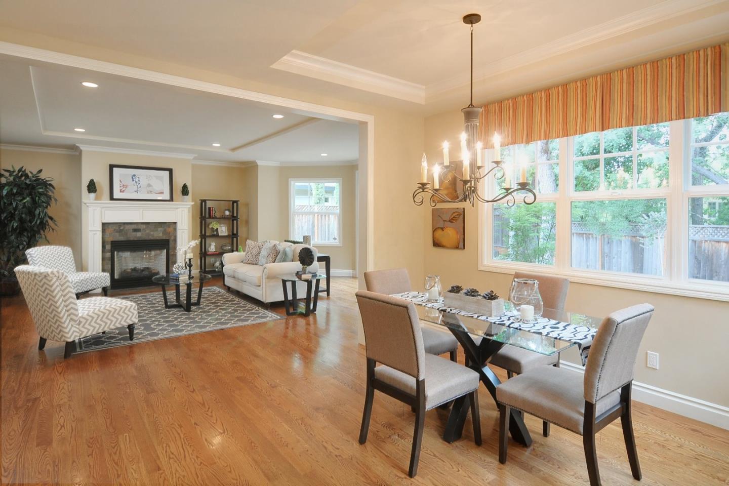 738 Springer Road Los Altos, CA 94024 - Photo 7 of 25 a view of a livingroom and a dining room with furniture window and wooden floor