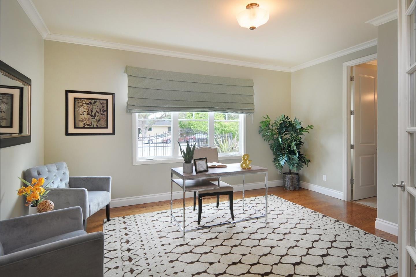 738 Springer Road Los Altos, CA 94024 - Photo 9 of 25 a living room with furniture and a potted plant