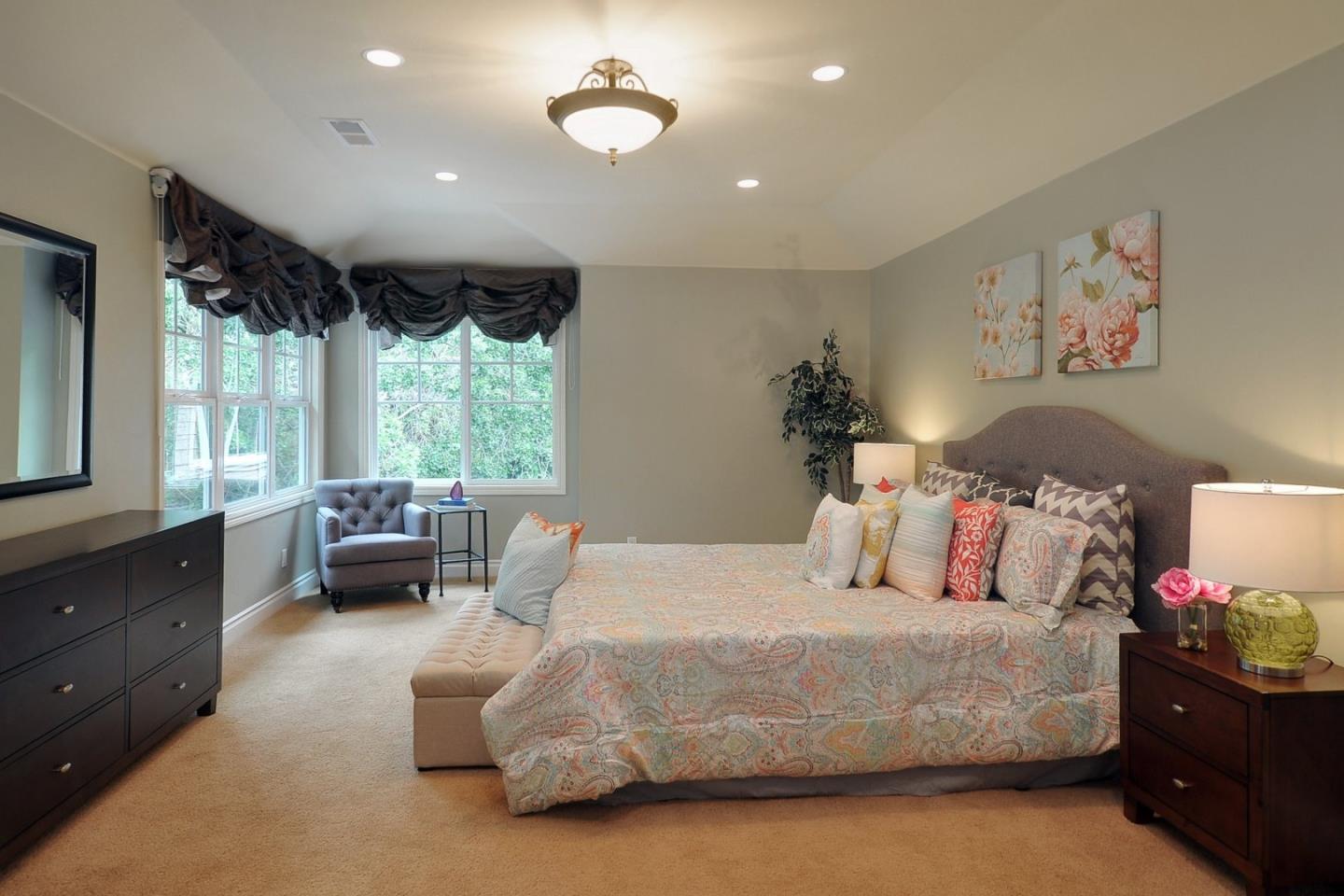 738 Springer Road Los Altos, CA 94024 - Photo 10 of 25 a bedroom with a bed and wooden floor