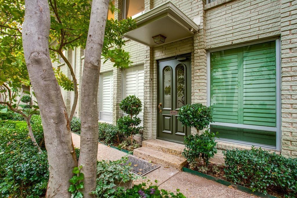 6345 Diamond Head Circle, Unit C Dallas, TX 75225 - Photo 1 of 1 a front view of a house with plants