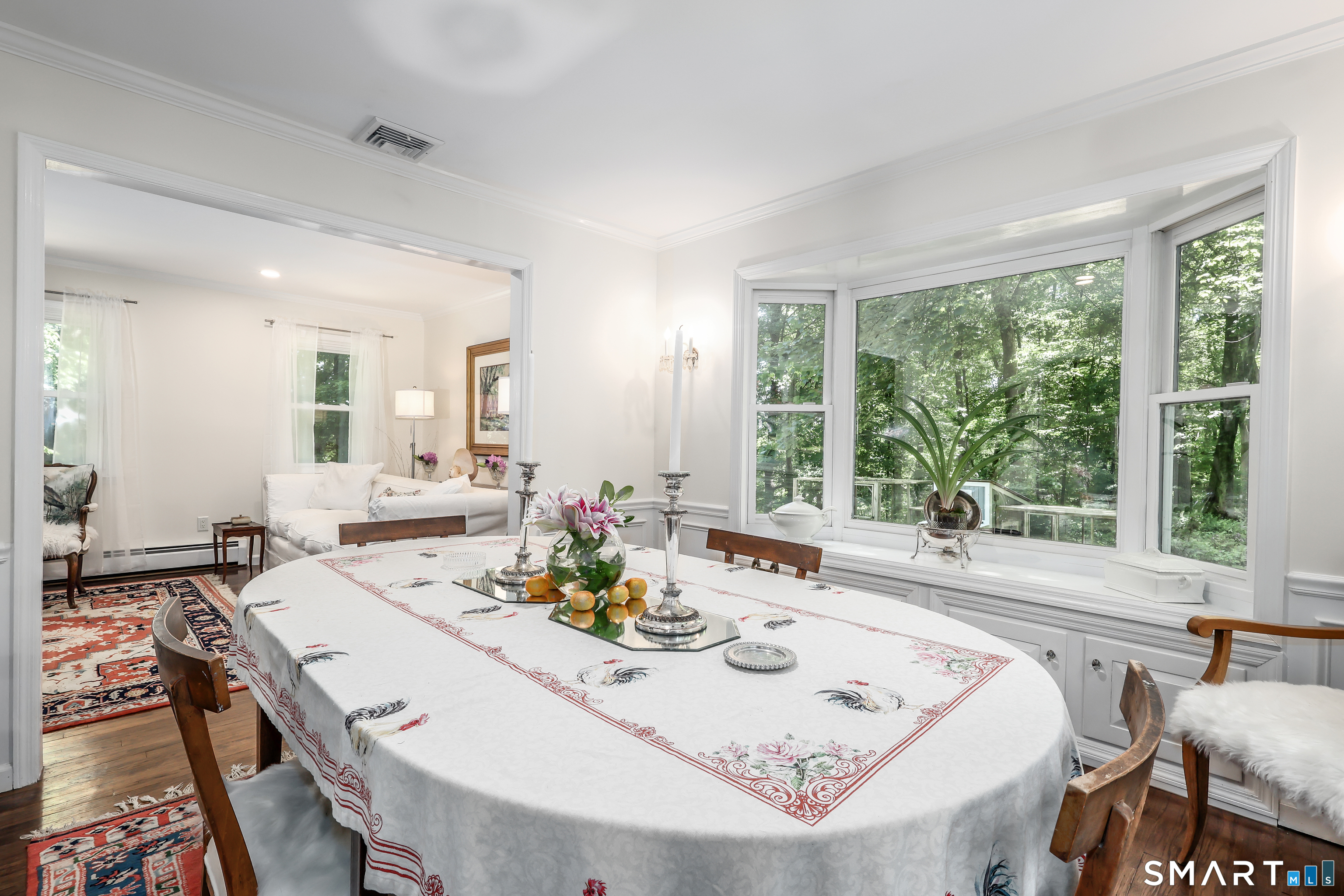 23 Old Green Road Newtown, CT 06482 - Photo 7 of 36 a dining room with furniture a large window and a table