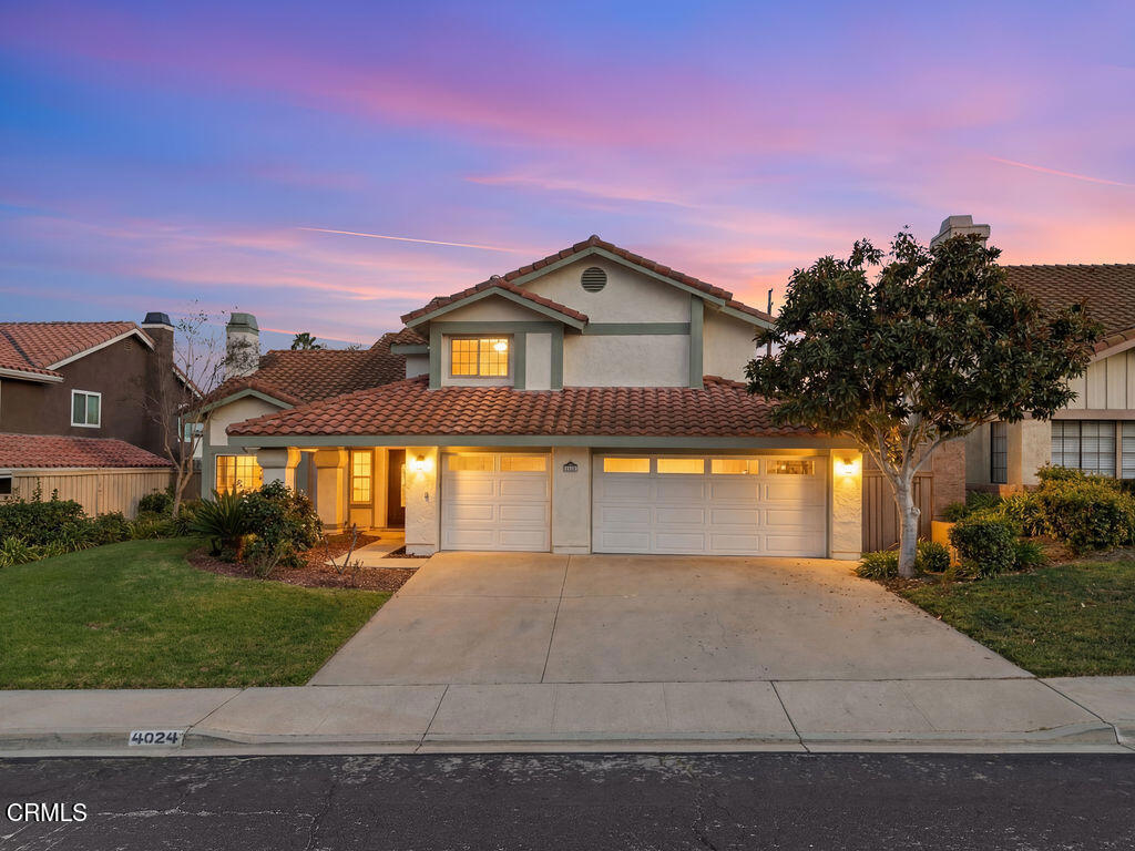 4024 Cliffrose Avenue Moorpark, CA 93021 - Photo 1 of 40 a view of a house with a yard and large trees