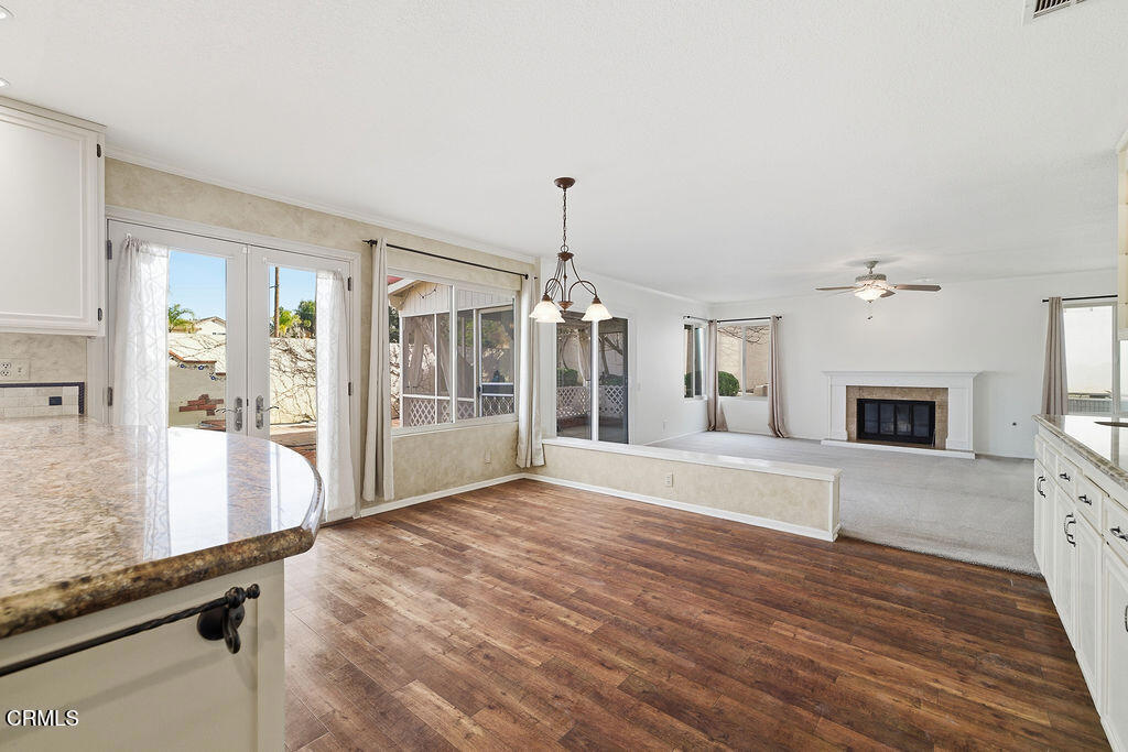 4024 Cliffrose Avenue Moorpark, CA 93021 - Photo 16 of 40 a view of a livingroom with wooden floor and chandelier
