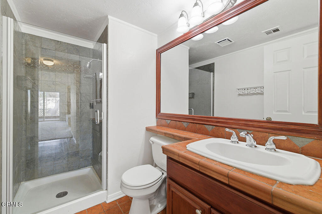 4024 Cliffrose Avenue Moorpark, CA 93021 - Photo 22 of 40 a bathroom with a sink and a mirror