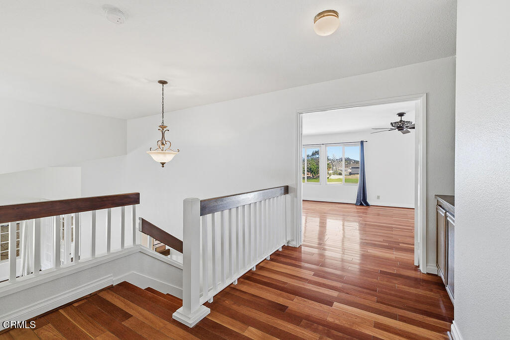 4024 Cliffrose Avenue Moorpark, CA 93021 - Photo 24 of 40 a view of a hallway with a hardwood floor