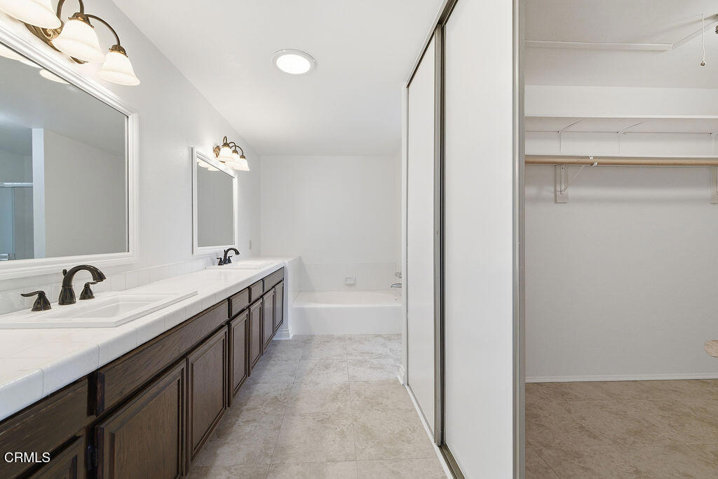 4024 Cliffrose Avenue Moorpark, CA 93021 - Photo 27 of 40 a bathroom with double sink and a mirror