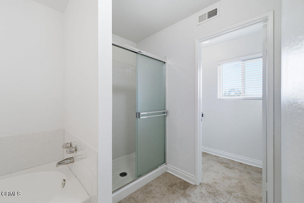 4024 Cliffrose Avenue Moorpark, CA 93021 - Photo 28 of 40 a bathroom with a bathtub and a shower