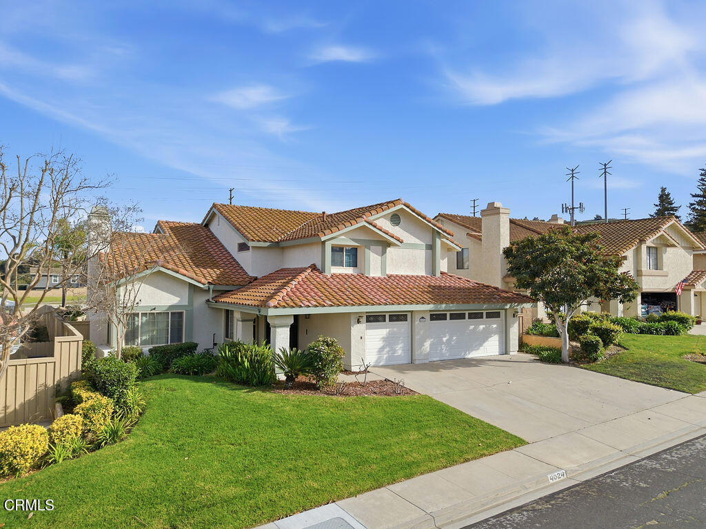 4024 Cliffrose Avenue Moorpark, CA 93021 - Photo 4 of 40 a front view of a house with garden