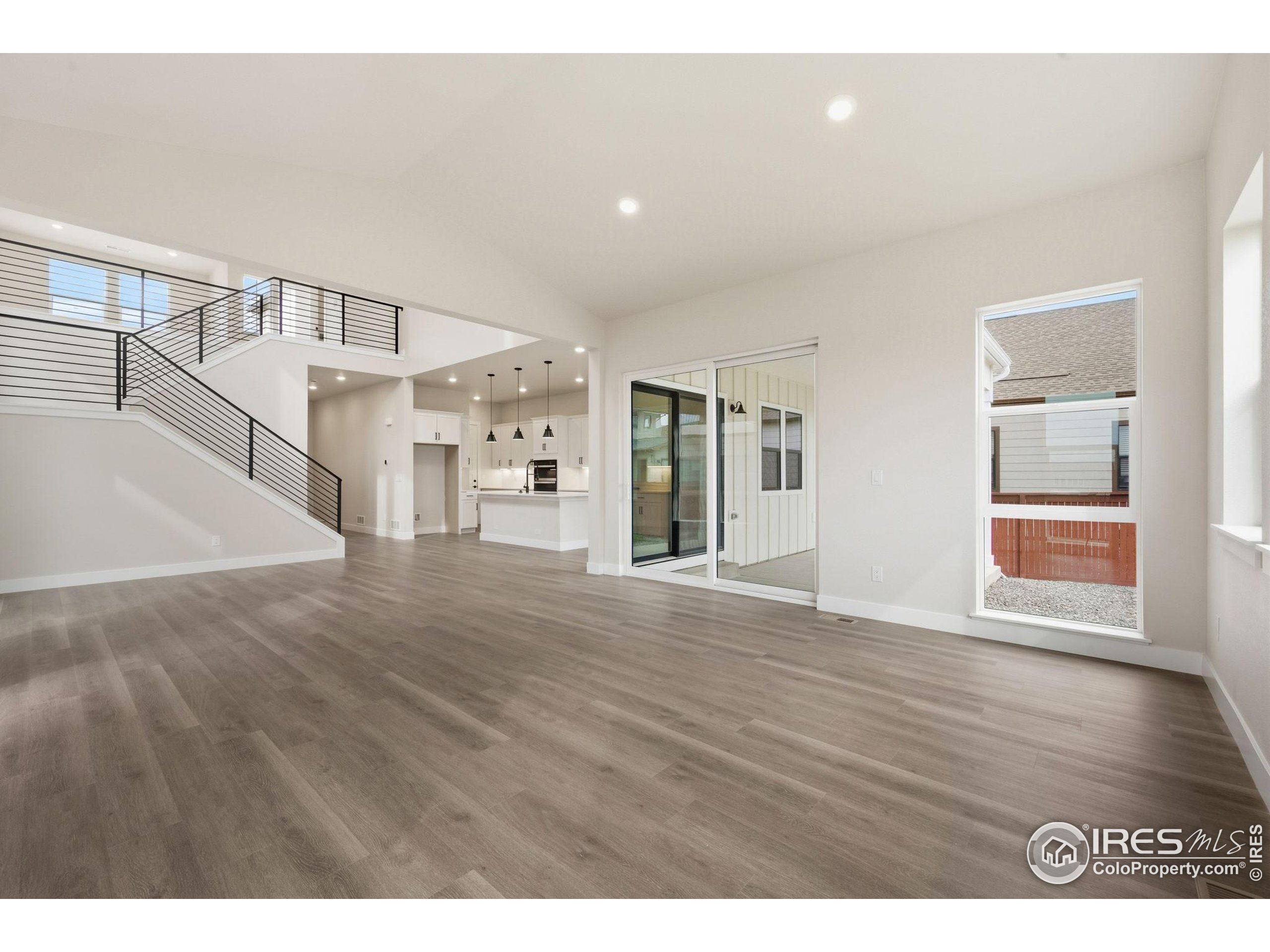 1675 Sundown Run Drive Windsor, CO 80550 - Photo 4 of 15 a view interior of a house wooden floor and windows