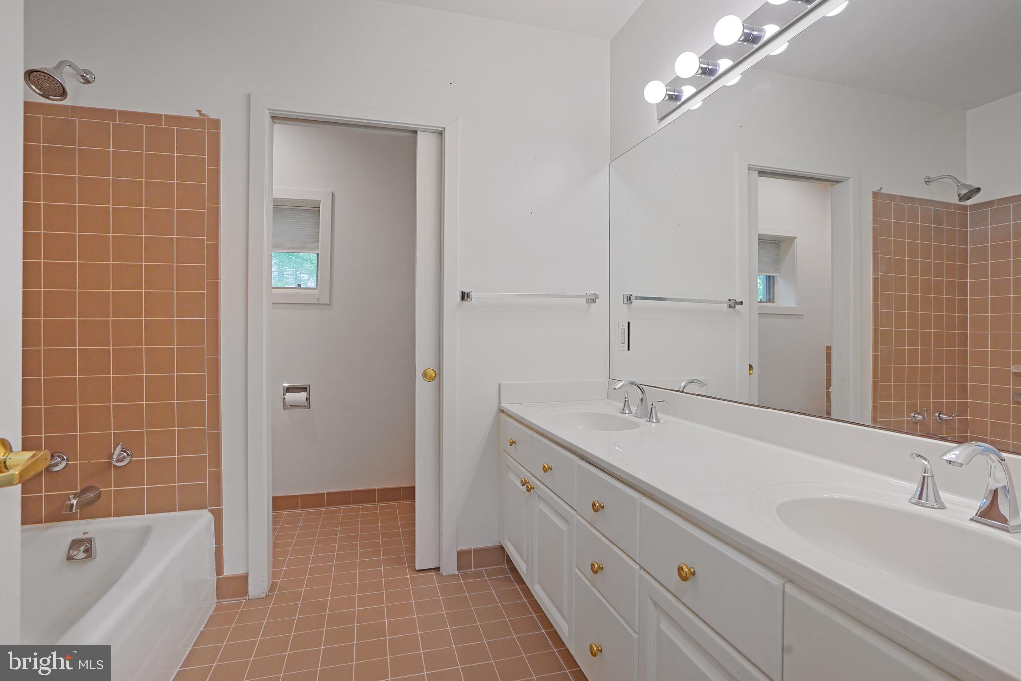 926 Saigon Road McLean, VA 22102 - Photo 48 of 54 Lower Lvl Full Bath w/ Pocket Door WC & Dbl Vanity