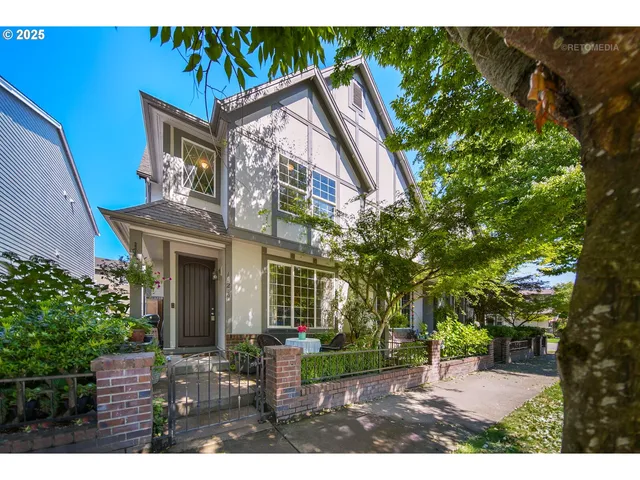 a view of a house with backyard and a sitting area