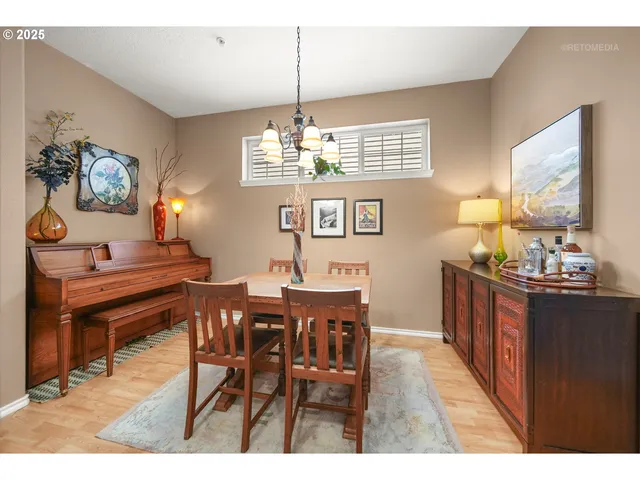 a dining room with furniture and window