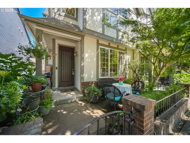 a view of a house with sitting area and garden