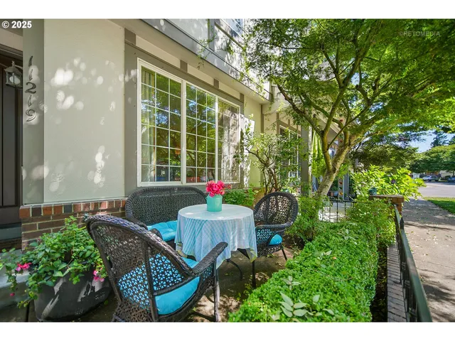 a view of a house with backyard sitting area and garden