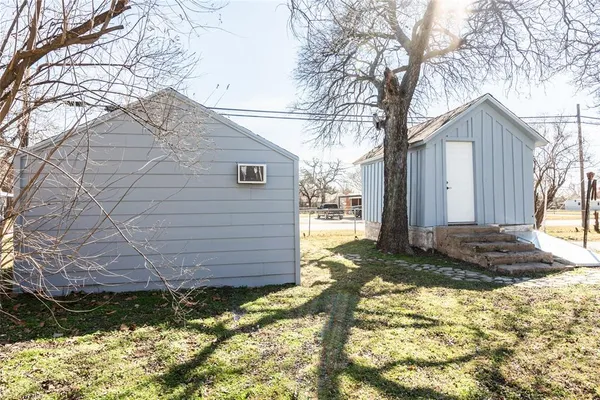 a view of a backyard of the house