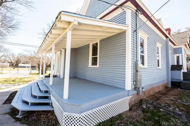a view of a terrace with wooden floor and fence