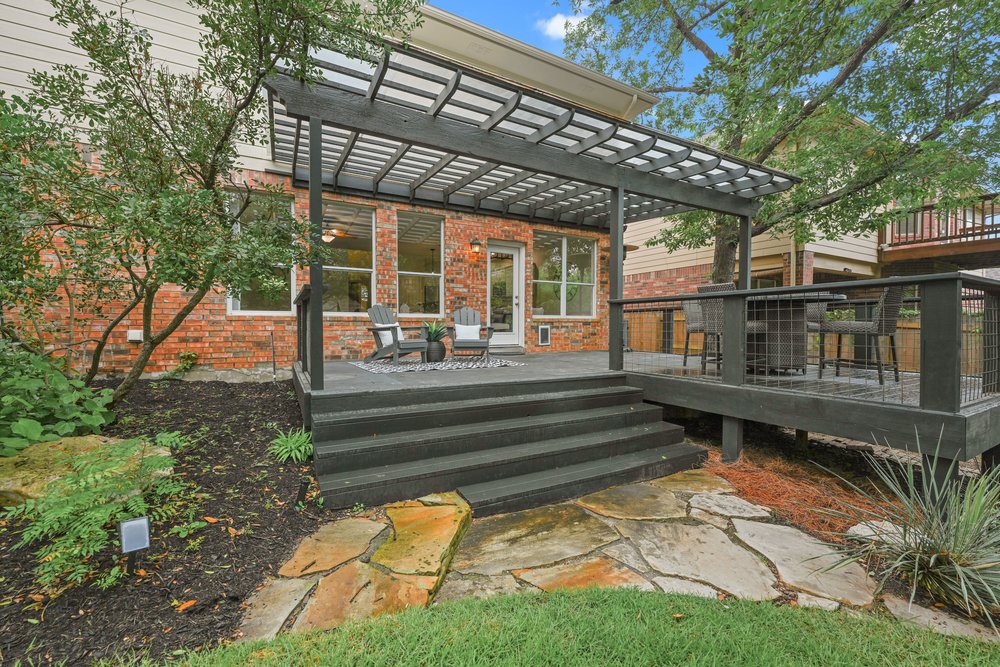 2823 Lantana Ridge Drive Austin, TX 78732 - Photo 27 of 34 a view of a house with a yard