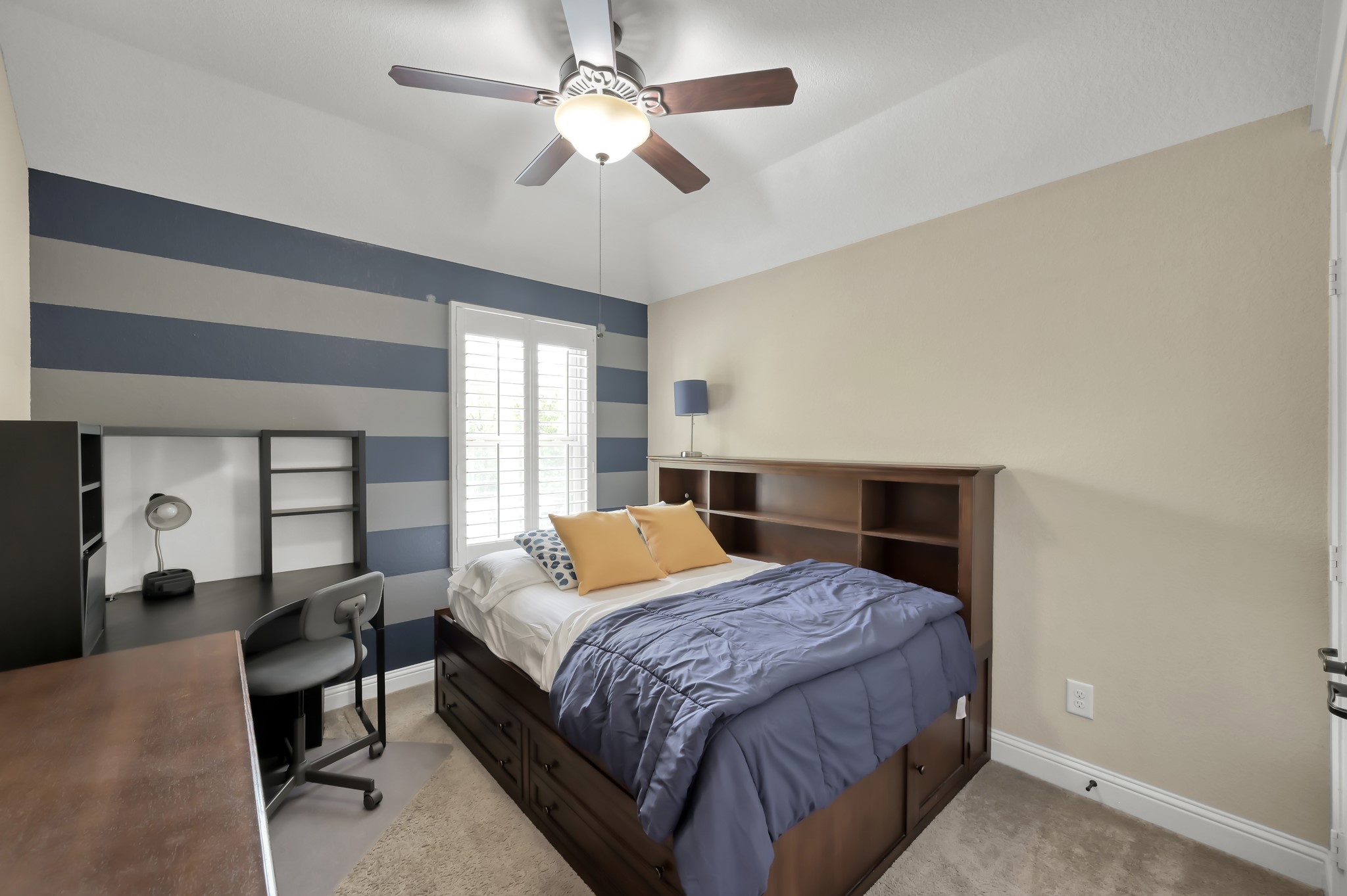 23 Rancher's Trail Tomball, TX 77375 - Photo 31 of 40 Another one of the 3 secondary bedrooms upstairs. This one features plantation shutters.