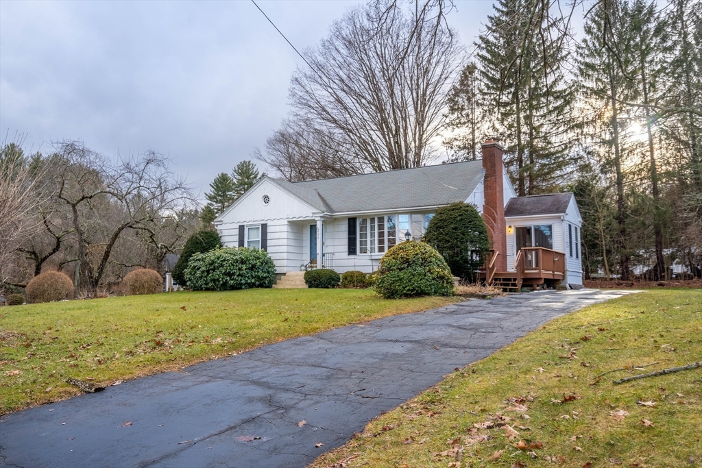838 Pleasant Street Rochdale, MA 01542 - Photo 20 of 30 a front view of a house with a yard and garage