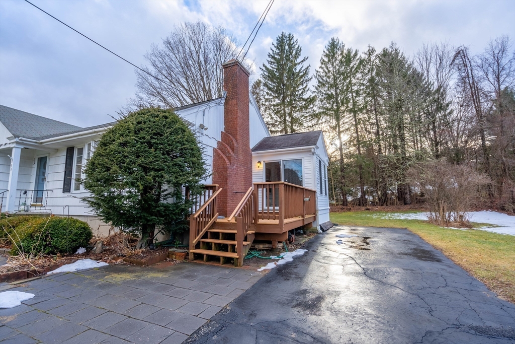 838 Pleasant Street Rochdale, MA 01542 - Photo 21 of 30 a view of a house with backyard and sitting area