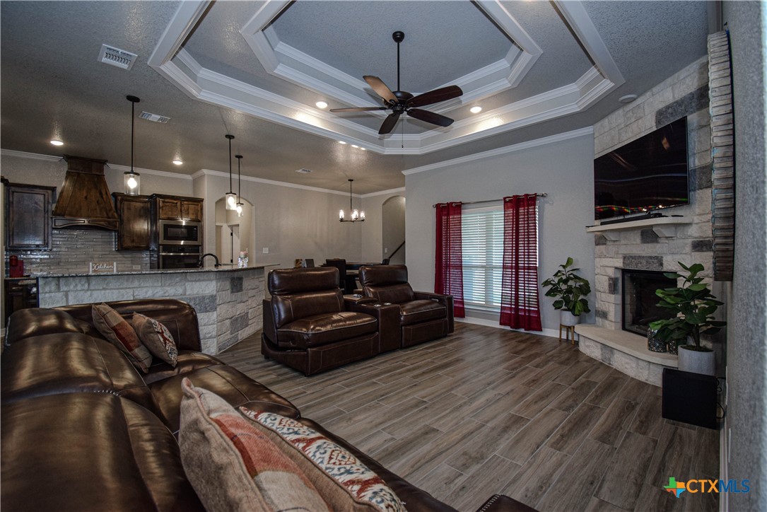 7623 Palladium Loop Killeen, TX 76542 - Photo 16 of 48 a living room with furniture a flat screen tv and a fireplace