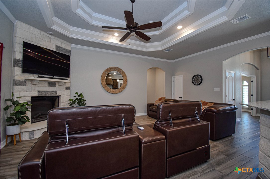 7623 Palladium Loop Killeen, TX 76542 - Photo 18 of 48 a living room with furniture a flat screen tv and a fireplace