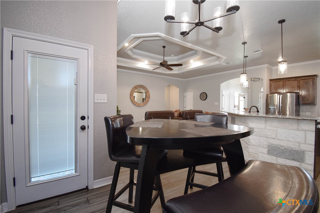 7623 Palladium Loop Killeen, TX 76542 - Photo 20 of 48 a view of a dining room with furniture and wooden floor