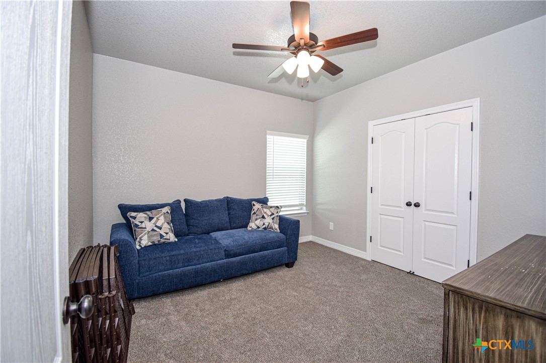 7623 Palladium Loop Killeen, TX 76542 - Photo 22 of 48 a living room with furniture and a ceiling fan
