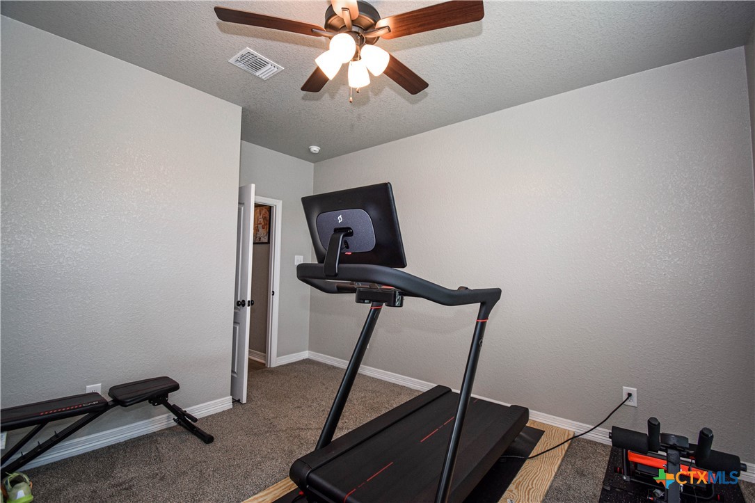 7623 Palladium Loop Killeen, TX 76542 - Photo 28 of 48 a room with gym equipment and windows